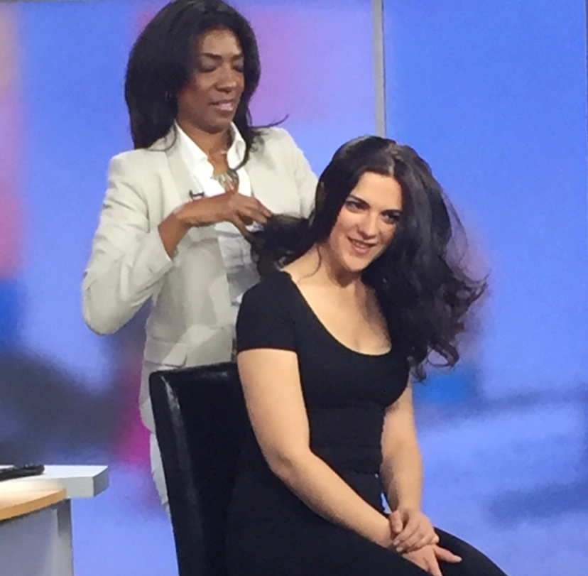 Hair stylist working on a woman's hair