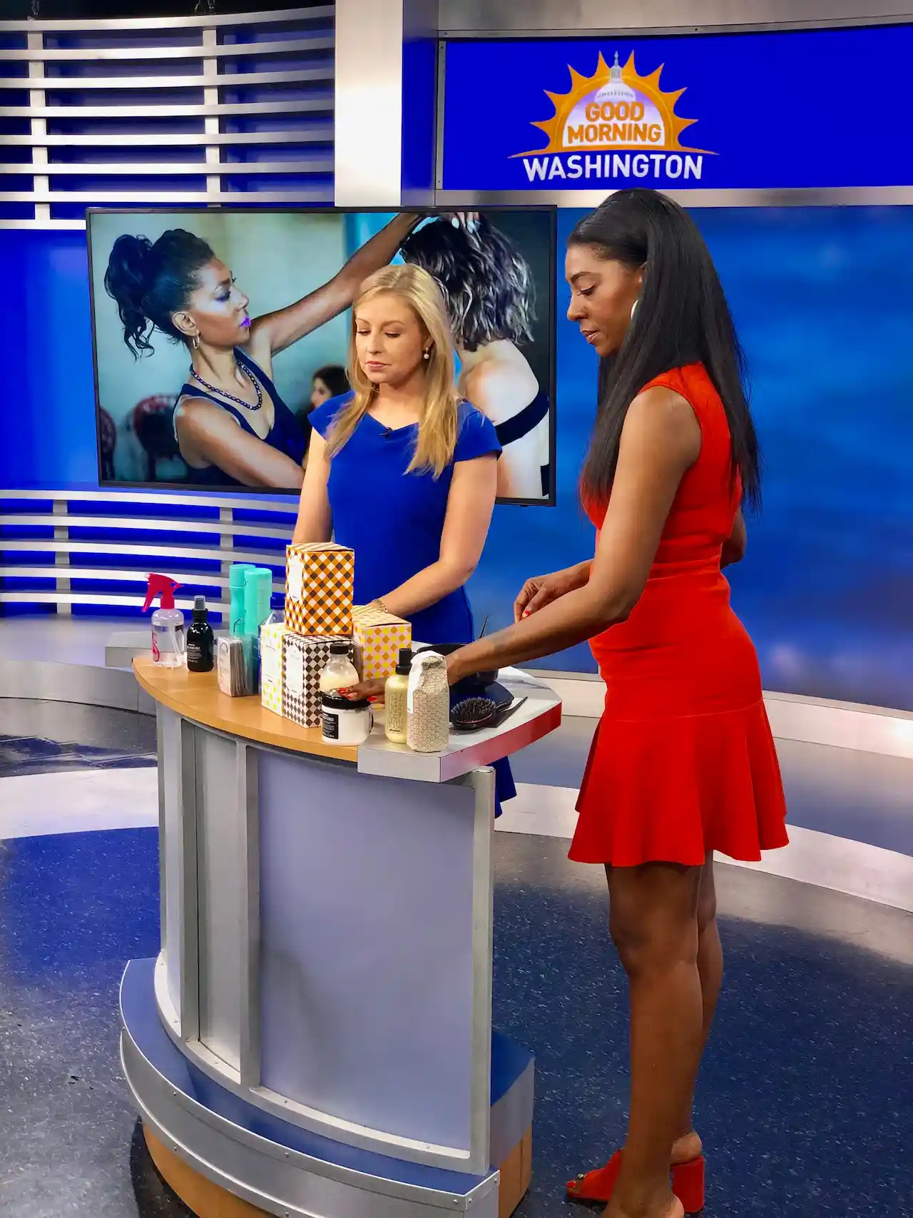 Two women presenting beauty products on TV